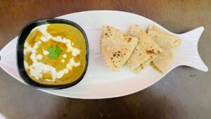 Beautiful and decorative image of paneer butter masala with Chapatis- Best Paneer Butter Masala near me